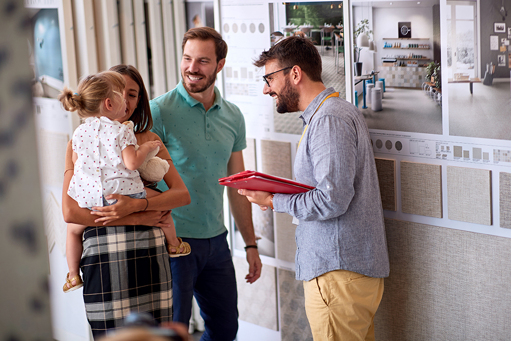 Young couple selecting finishes for new home in Australia